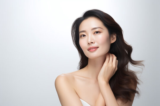 Asian Chinese woman face with smooth health skin for advertising design. Korean or Japanese Beautiful aging young looking woman, beauty health skincare and cosmetics advertisement commercial ad