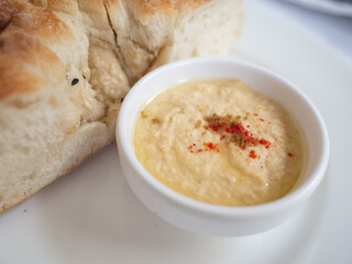 hummus and bread as appetizer on the white plate in tatar restaurant in capital kyiv