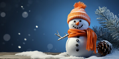 Fototapeta premium Snowman in an orange hat and with an orange scarf on a blue background