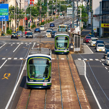 Hiroshima, JAPAN - July 26, 2023: Hiroshima Electric Railway Train Running On The Street Of Hiroshima Central Area.