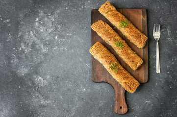 Turkish dessert kadayif, Shredded dough baked in syrup topped with crushed pistachios, Turkish...