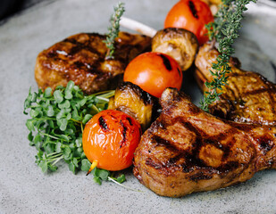 Delicious grilled pork chop on plate