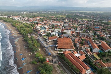 Fototapeta premium urban aerial view on the beach. houses with terracotta roof tiles. beach views in Indonesia. Pangandaran beach. 