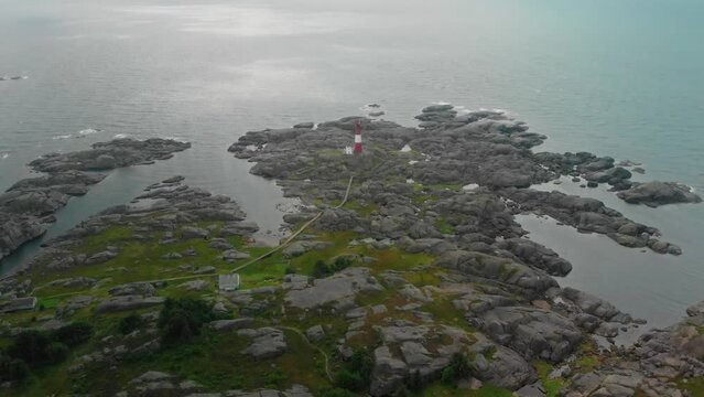 drone flies over lighthouse on norwegian south coast Eigeroy Fyr