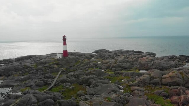 drone flies over lighthouse on norwegian south coast Eigeroy Fyr