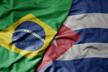 big waving realistic national colorful flag of brazil and national flag of cuba .
