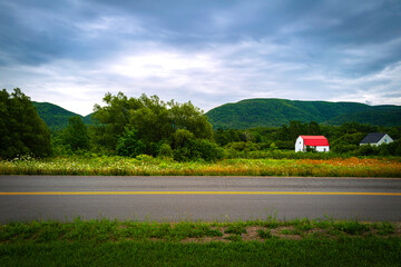 Beautiful farmland and Sugarloaf Mountain Wilderness Area in Chéticamp near Cape Breton Highlands...