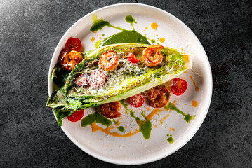 plate of stir fry with pak choi, cheese and shrimps on the table
