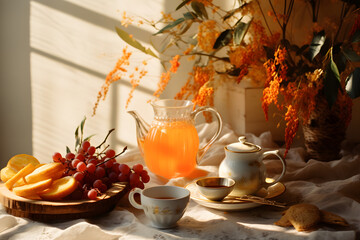 Glass cup of tea, with fruit and cookies, sunny Autumn day atmosphere, decorated with leaves
