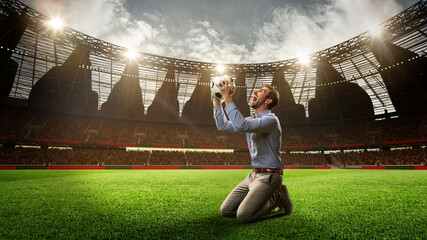 Man standing on knees on football arena, holding ball, shouting, celebrating win of money. Successful betting. 3d render. Concept of sport, fan, betting and finances, gambling, bookmaker