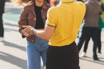 Couples dancing traditional latin argentinian dance milonga outdoor in the city streets, tango...