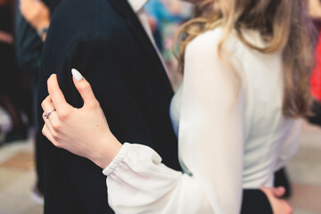 High school graduates dancing waltz and classical ball dance in dresses and suits on school prom...