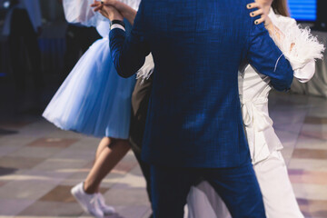 High school graduates dancing waltz and classical ball dance in dresses and suits on school prom graduation, classical ballroom dancers dancing, waltz, couples quadrille and polonaise - obrazy, fototapety, plakaty