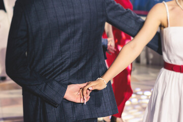 High school graduates dancing waltz and classical ball dance in dresses and suits on school prom...