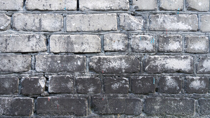 Old black-white brick wall