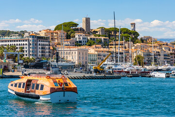 Cannes seafront panorama with castle hill over historic old town Centre Ville quarter and yacht port at French Riviera of Mediterranean Sea in France - obrazy, fototapety, plakaty