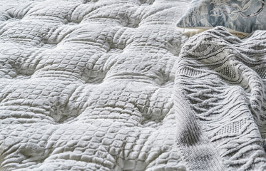 Bed surface close up style, quilted face, white.