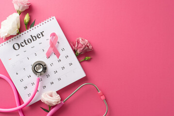 Raising awareness for Breast Cancer Awareness Month. Top view picture featuring a calendar,...