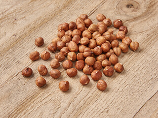 Delicious nuts and dry fruits on the background, close up style, in the plate still life.