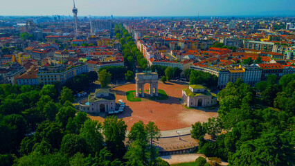 Naklejka premium Gate Sempione Porta Sempione city gate to Lombardy in the fall. Arch of Peace. Arco della pace. sunny evening in milan city park aerial panorama 4k italy milano city triumphal arch. Sculptures