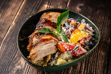 Baked pork ribs with baked vegetables: pepper, onion, tomato, eggplant, zucchini and basil, Restaurant dishes for home cooking.