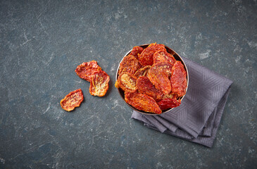 Delicious dry tomato and dry fruits on the background, close up style, in the plate still life.
