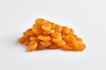 Delicious dried apricots and dry fruits on the background, close up style, in the plate still life.