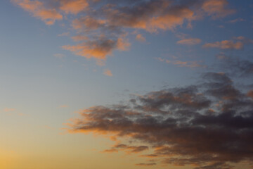 Fototapeta na wymiar Beautiful warm sunrise sky with clouds.