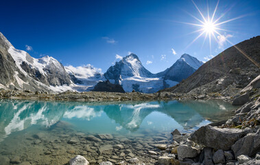 panorama of Dent Blanche, Grand Corner with reflection in an glacial lake, Valais