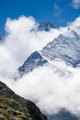 cloud and snow covered peaks of Grand Cornier and Dent Blanche in the background, Valais