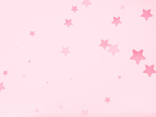 Cute pink stars of different sizes and densities scattered in the pink space