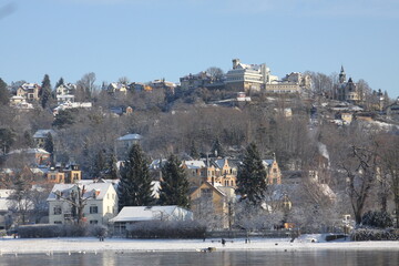 houses on the banks of the river Elbe on a winter sunny day in Dresden