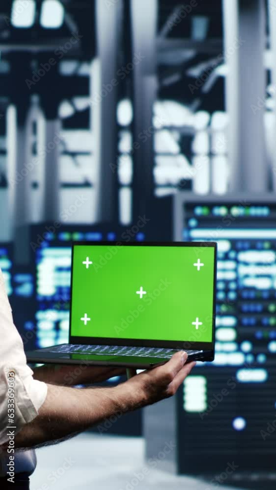 Poster vertical video knowledgeable it professional navigating network of server racks in industrial hub. r