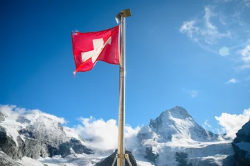 Fotobehang swiss flag at Cabane du Mountet in front of Dent Blanche, Valais © schame87