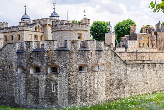 London, United Kingdom, 21 june 2023:The Tower of London,  a castle and a former prison River Thames museum  Landmark architecture sunny cloudy sky Europe. his majesty's royal palace fortress