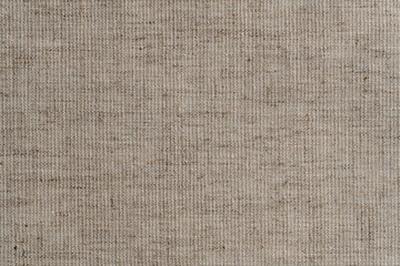 Fototapeta premium Natural vintage linen texture as background, macro. Light cream linen fabric texture, old rustic canvas. Top view, closeup