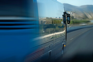 Tourist bus on a highway, motion blur effect - side view