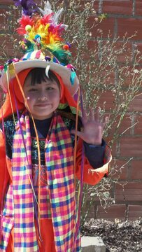 vertical video of latin girl with colorful folkloric costume to dance tinku in bolivia