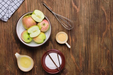 Ingredients for cooking airy whipped apple mousse on a brown wooden background. Desserts apples.