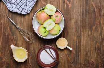 Ingredients for making airy whipped apple mousse on a brown wooden background. Desserts apples.