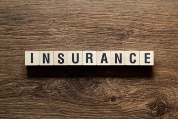 Insurance - word concept on building blocks, text