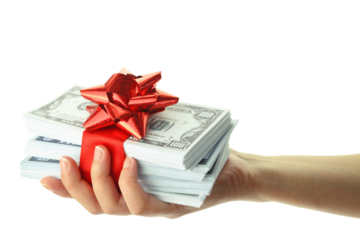 Money gift in a female hand, isolated on white transparent background, PNG. US dollars stack and red bow, festive present. 