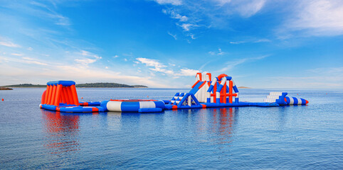 Fototapeta na wymiar Water inflatable attraction on the sea coast.
