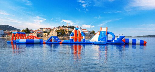 Fototapeta na wymiar Water inflatable attraction on the sea coast.