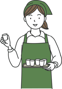 試食販売（試飲販売）をするエプロン姿の女性店員