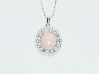 Silver jewelry and gemstone on white background