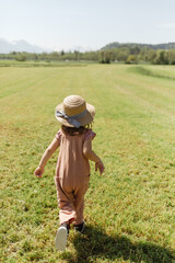 Carefree girl running in countryside field