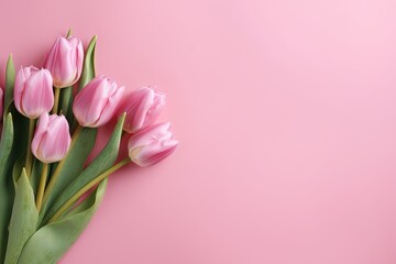 Obraz premium Spring tulip flowers on pink background top view. Generative AI.