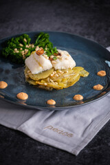 Delicious gratin with white fish and sauce with broccoli