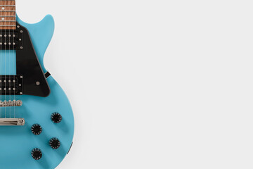 Blue electric guitar on white background